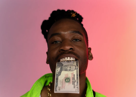 Why do rappers wear grillz?
